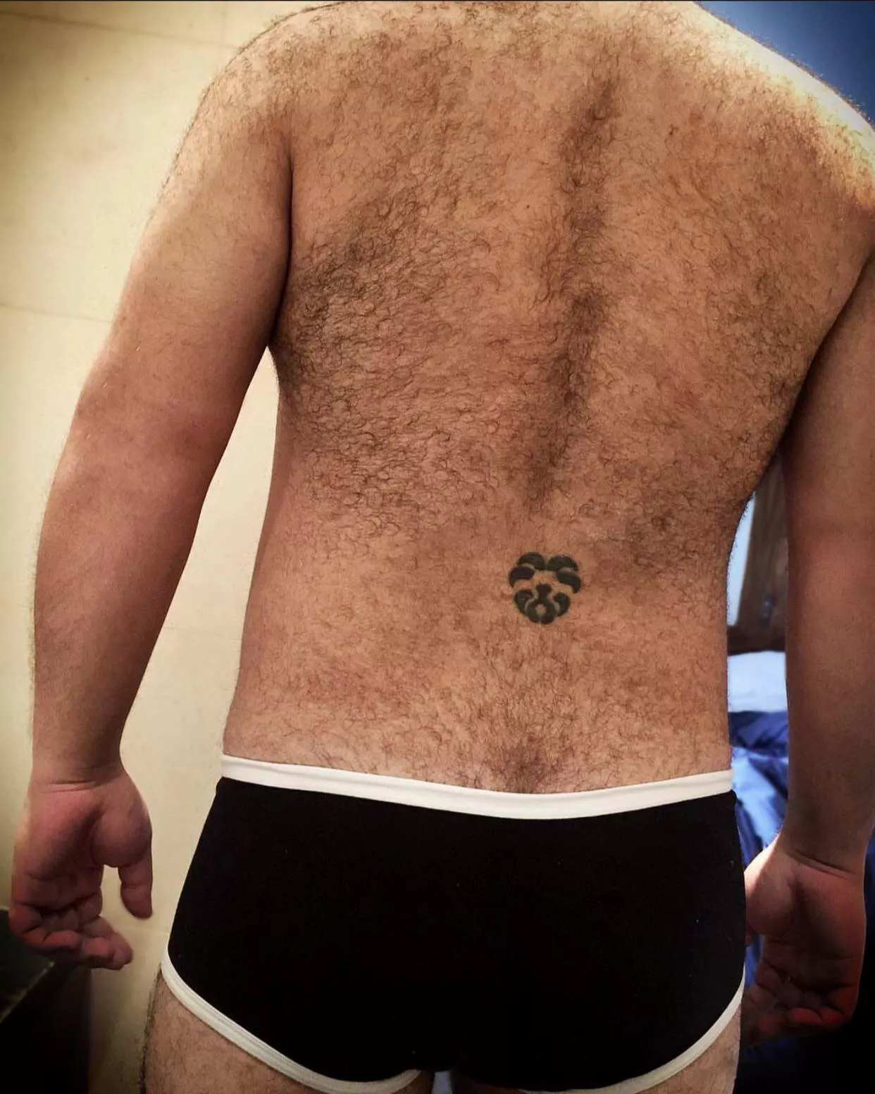 [35] Meet the lion tattoo on dad’s hairy back.