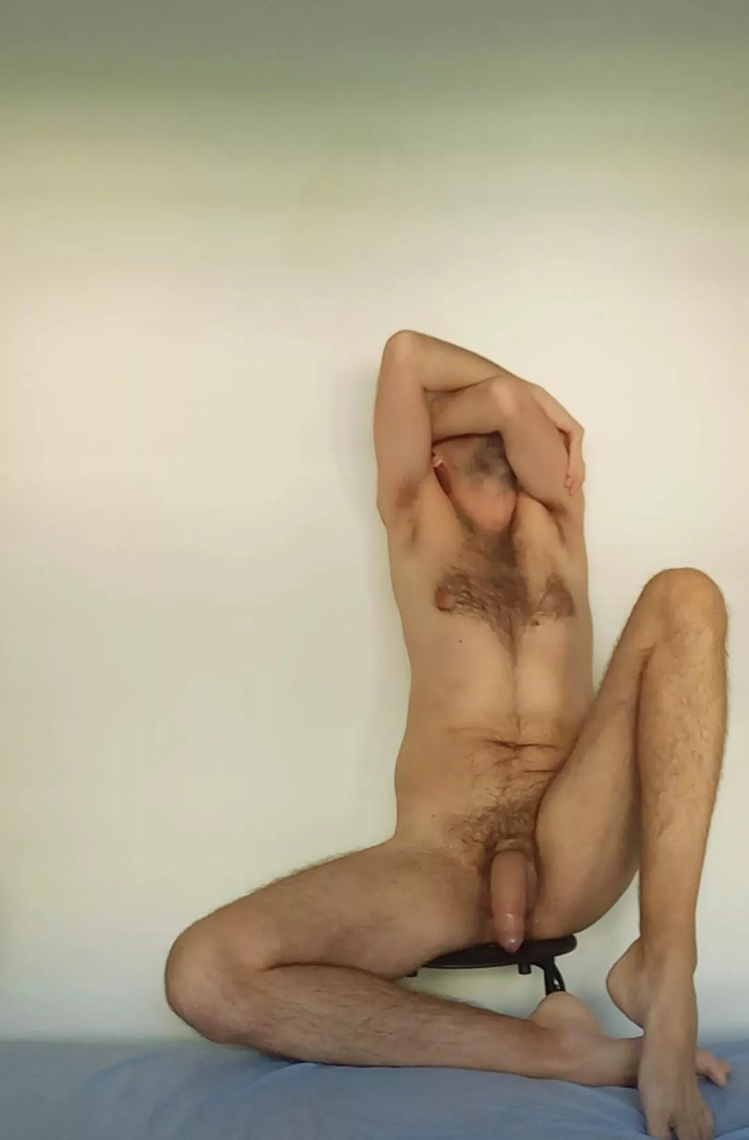Against the wall