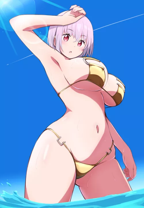 Akane in a gold bikini