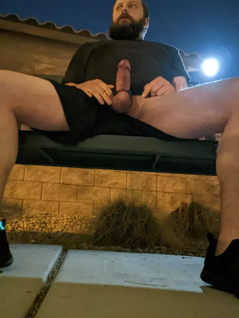 At a bench in a park. I wonder if that bright light was a camera...