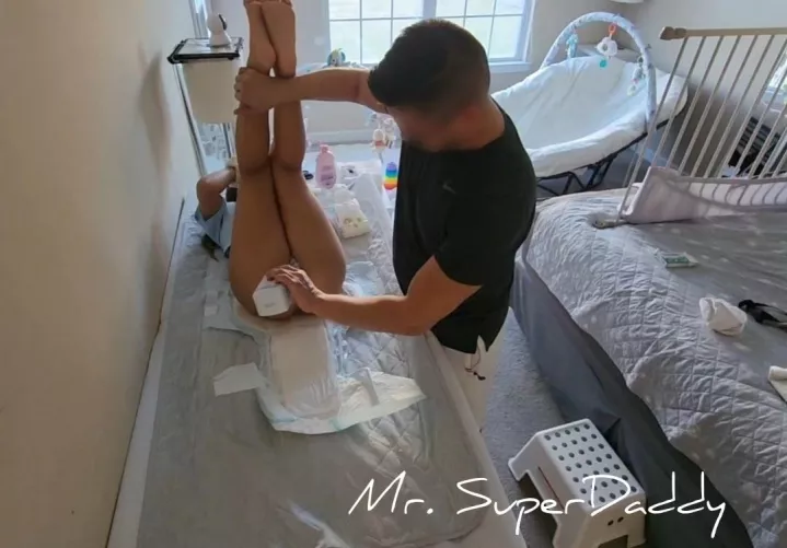 Baby girl recieves a little TLC from dada