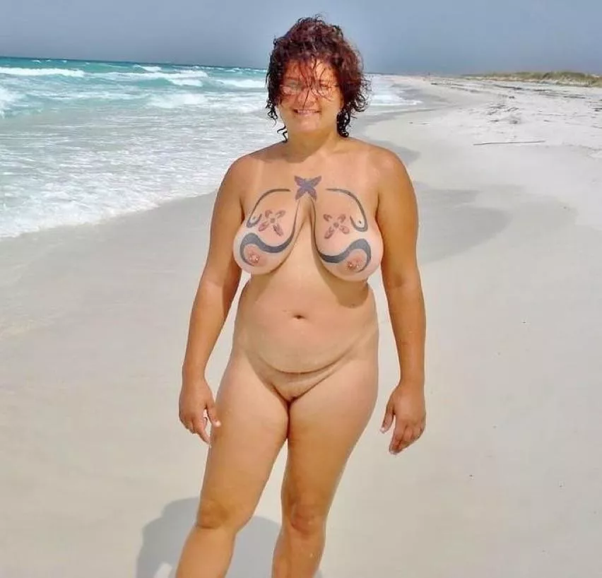 Beach nudist with Body painting on breasts