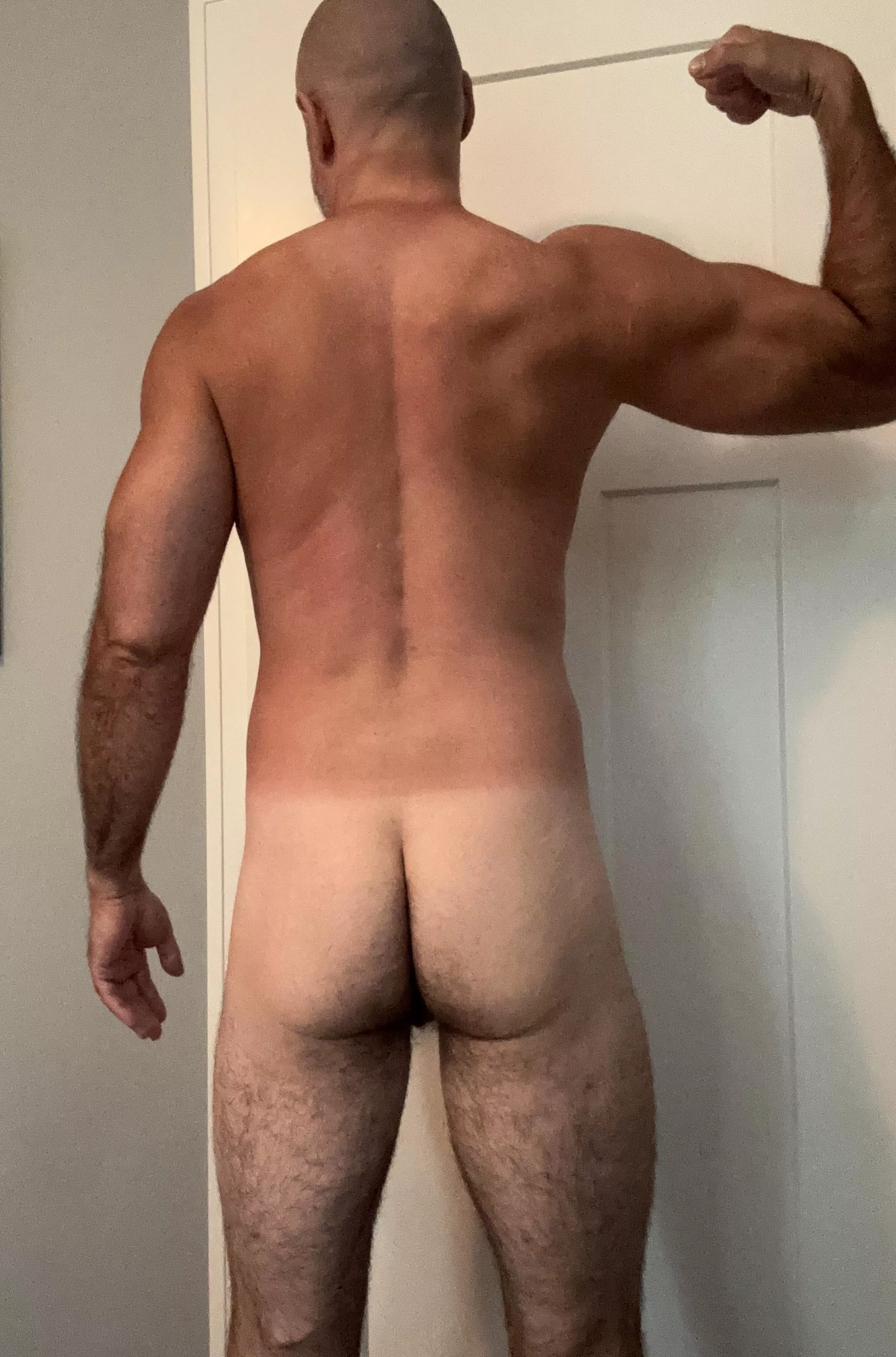 Behind 