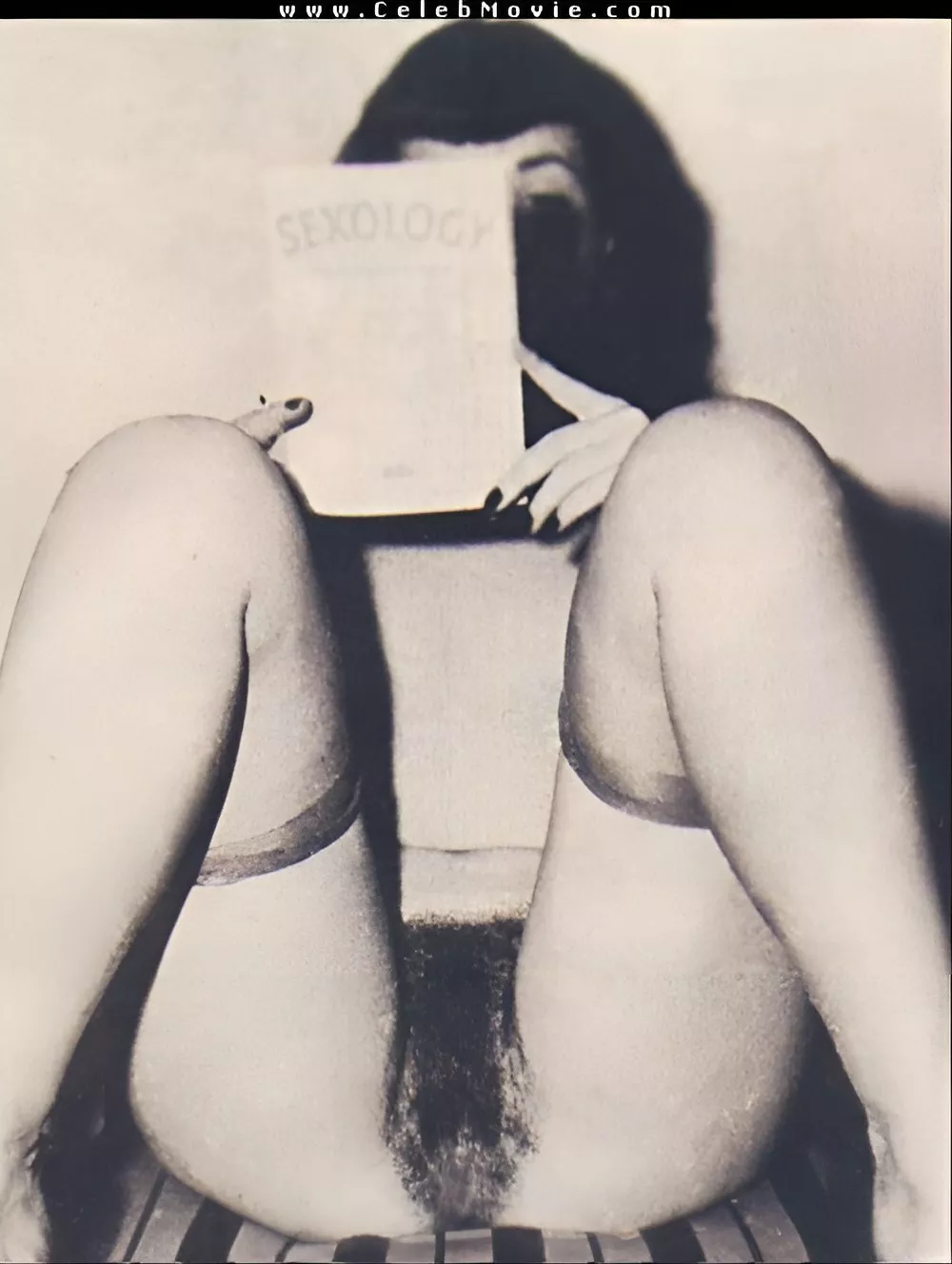 Bettie Page reading sexology magazine and showing off her hairy pussy