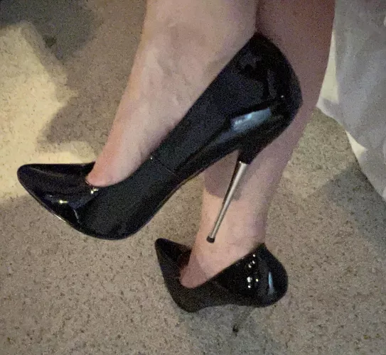 Black stilettos with silver tipped heel