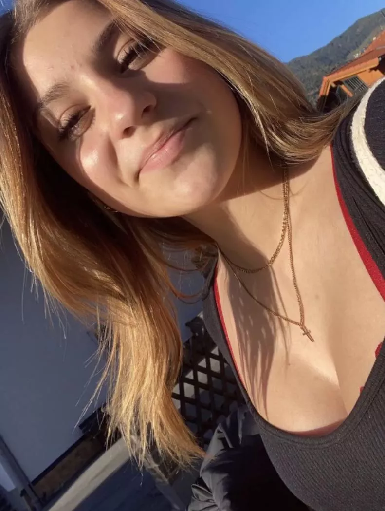 Cross above titties