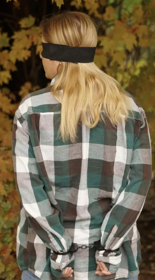 Cuffed and blindfolded