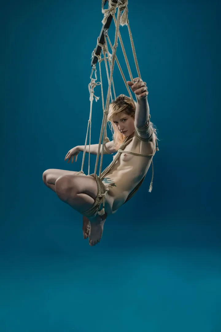 Diana Oliphant suspended on blue - rope and photo by me (The Dark Arts)