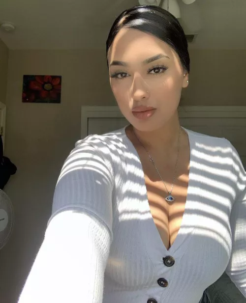 Doing her best to hide those puppies