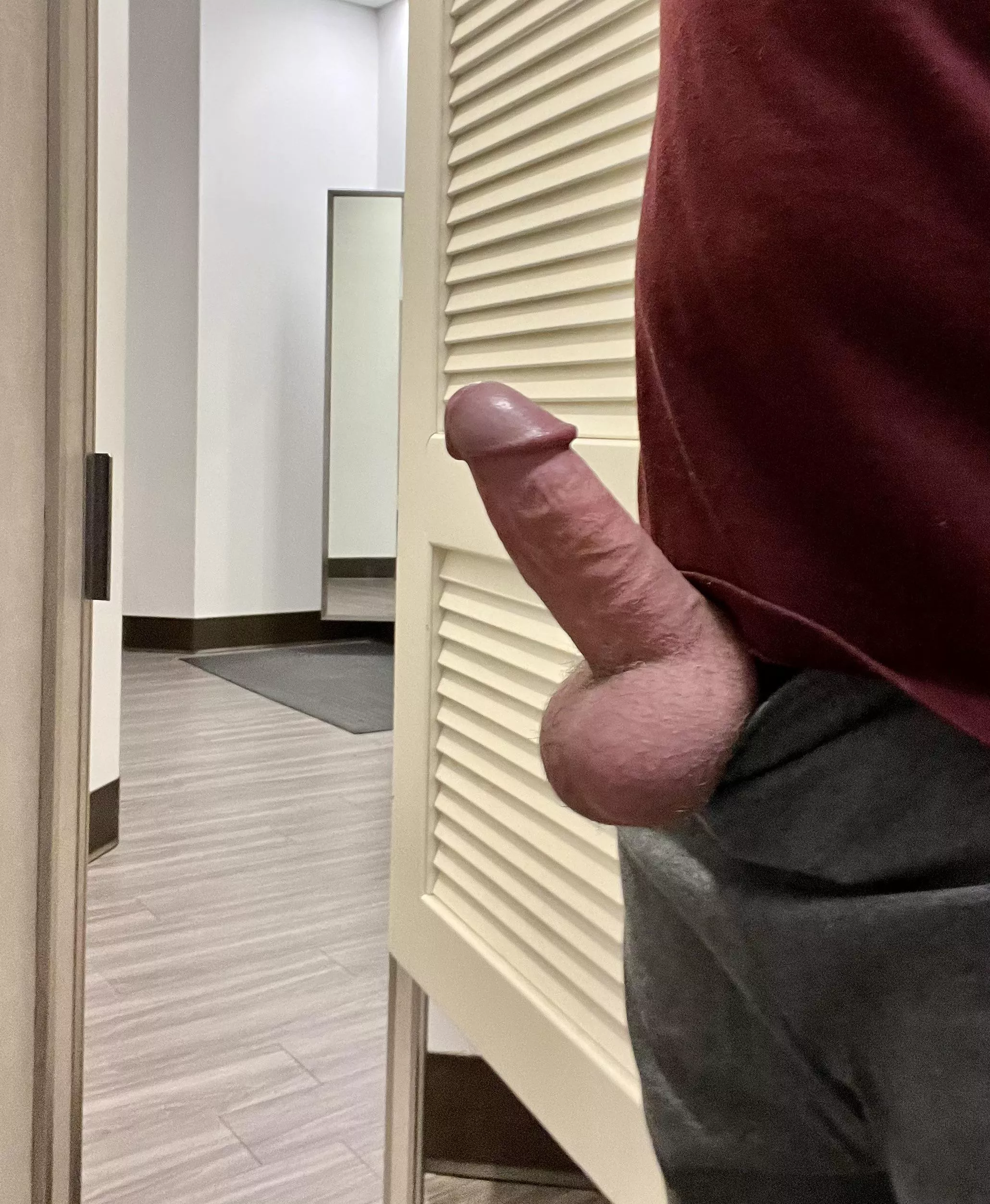 Dressing room door open. Shopping for new sweets.