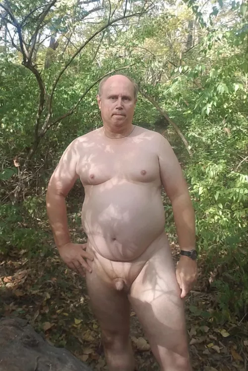 Enjoying being nude in nature.