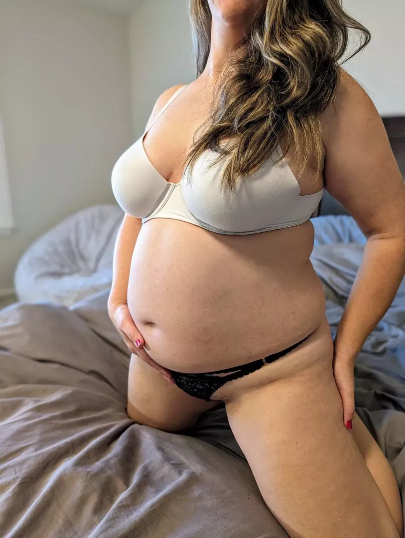 Feeling a little frisky tonight? My sexy pregnant belly is ready for action.