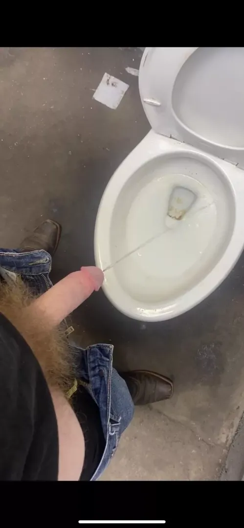 Hands free pissing at a dirty truck stop. It might get splashy!