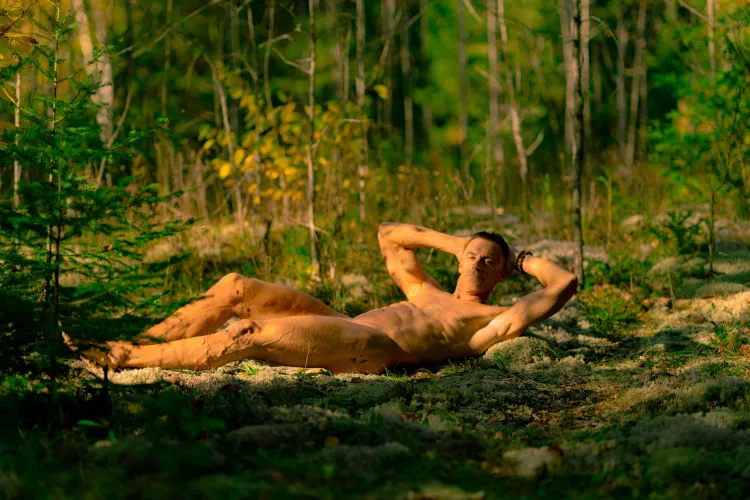 Happy nudist in the wilderness