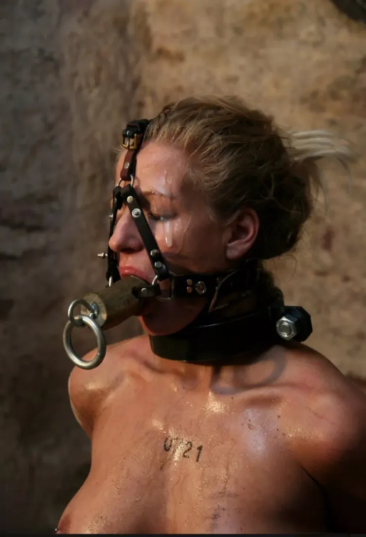 Harness gagged whore covered in cum