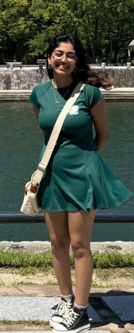 Her bag is doing a great job of showing off her bra lines and huge tits