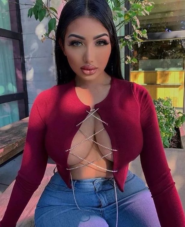 Her top barely holds it