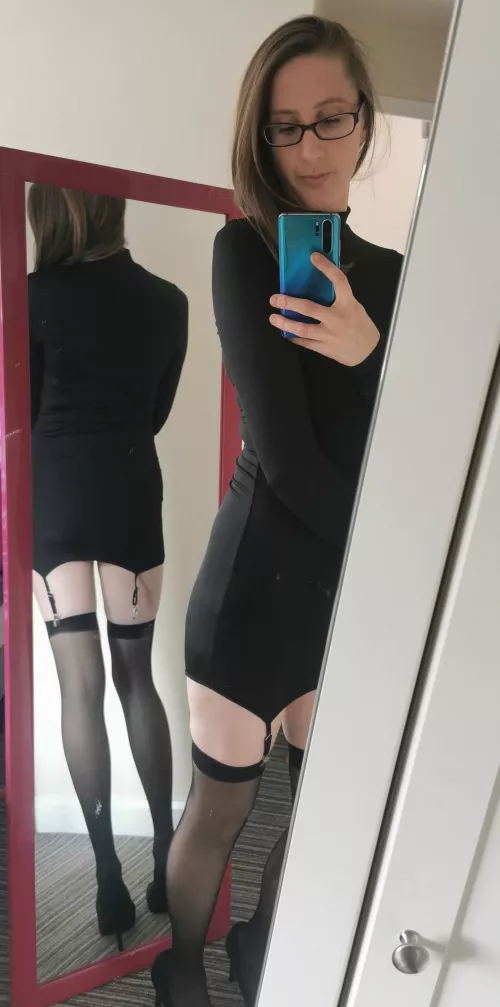 I love this black dress with the stockings and heels!
