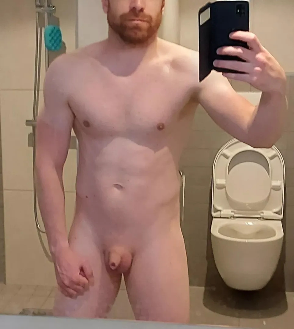 I'm a young guy showing off my muscles and what's between my legs