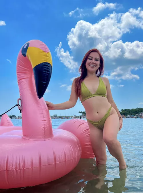 Just a girl in a bikini and her duck