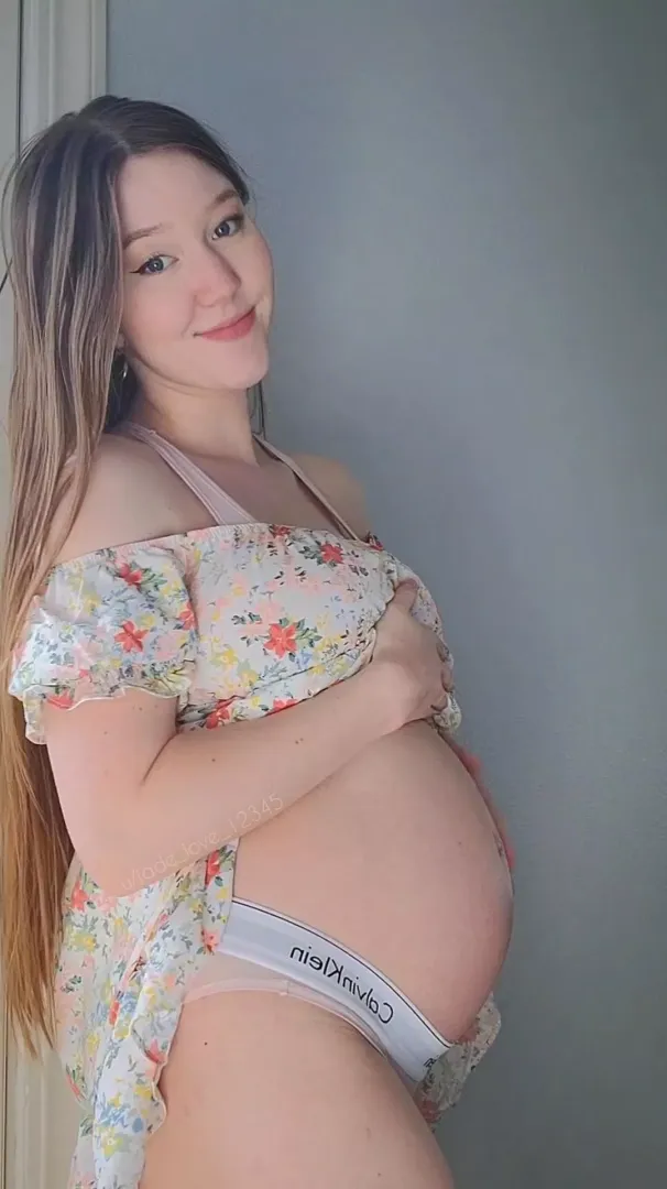 Just a little peek under my dress at my pregnant belly 