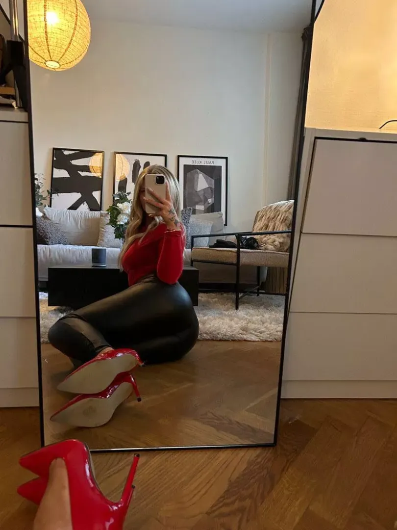 Leather pants, and red heels