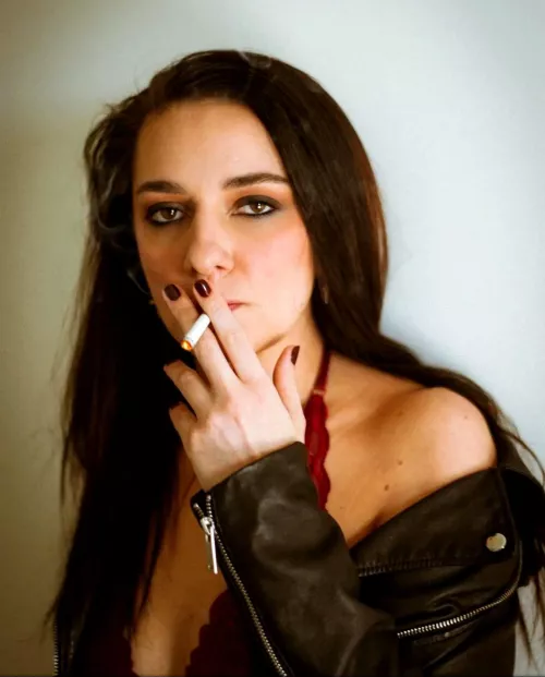 Lovely brunette girl smoking