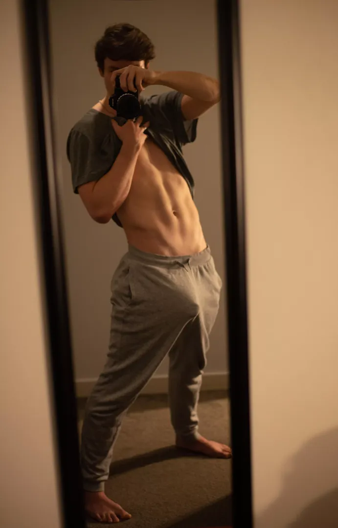 My big young cock is trying to bust through my sweatpants