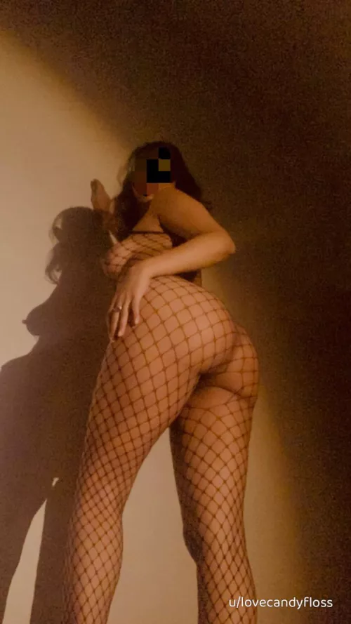 Perky tits and a cute butt wrapped in fishnets 🍑