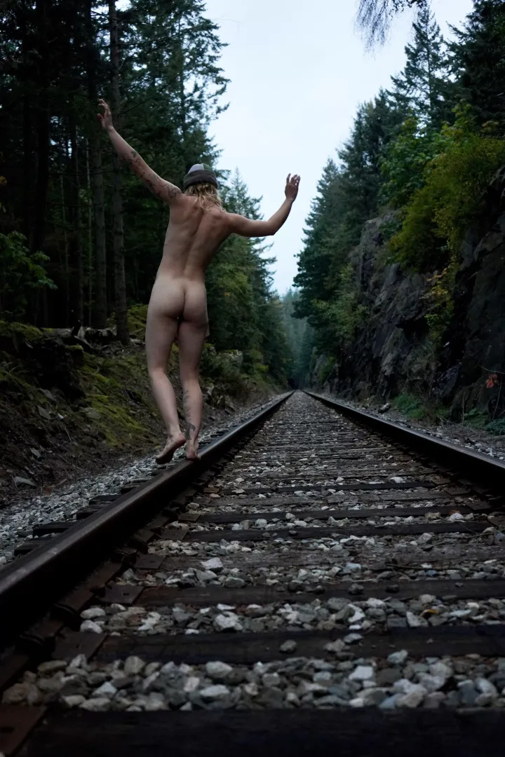 Playful forest nymph on the tracks
