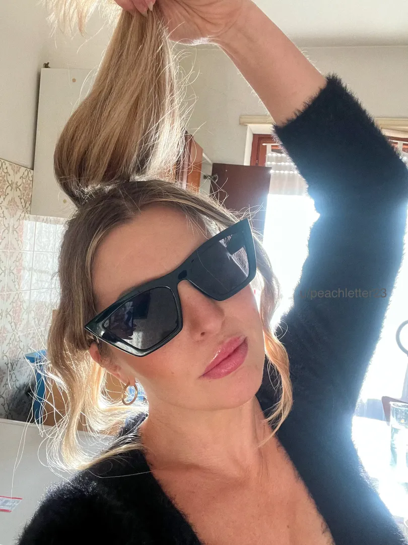 Ponytail and sunglasses