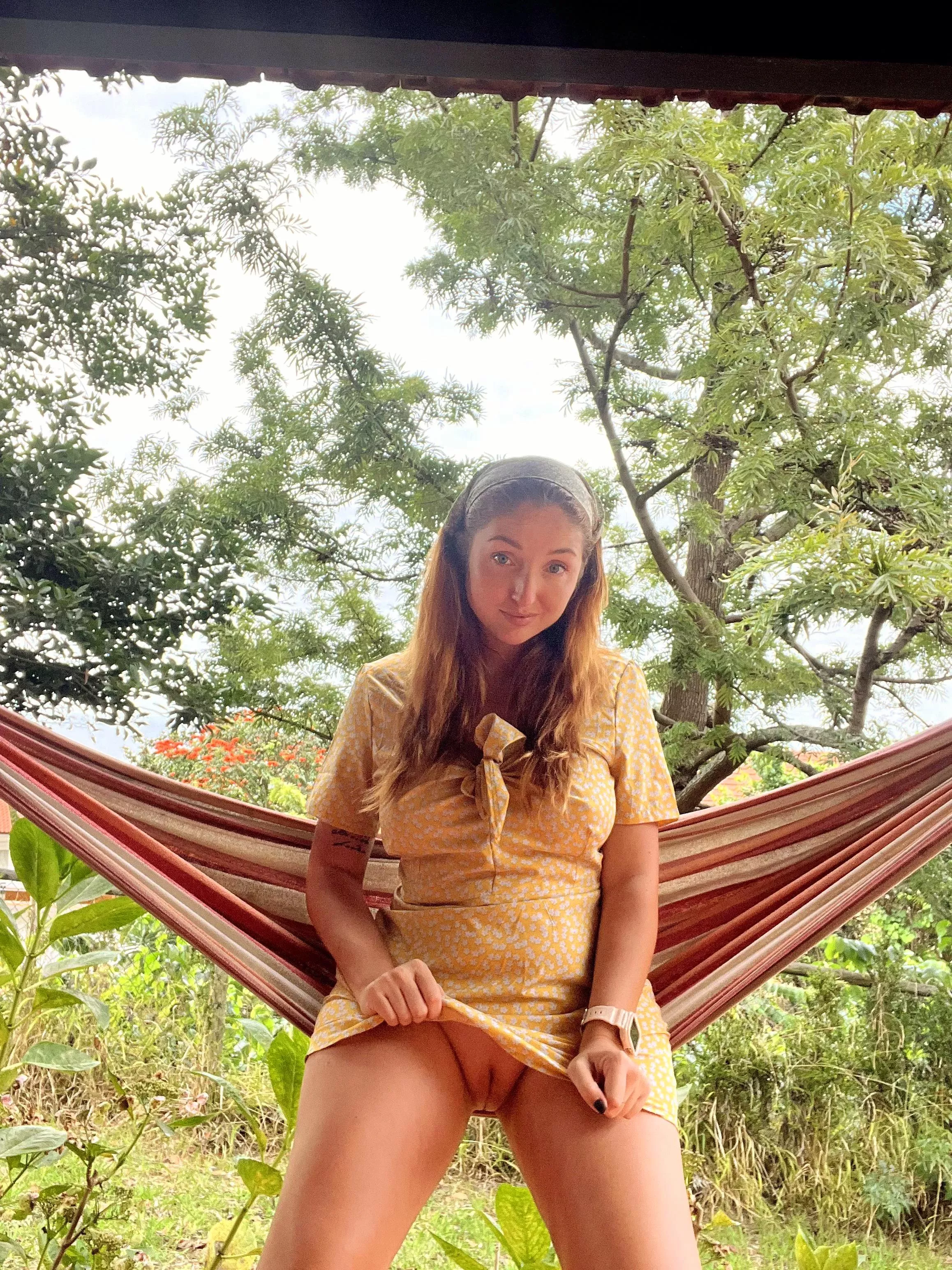 Red Fox flash her pussy in a hammock.