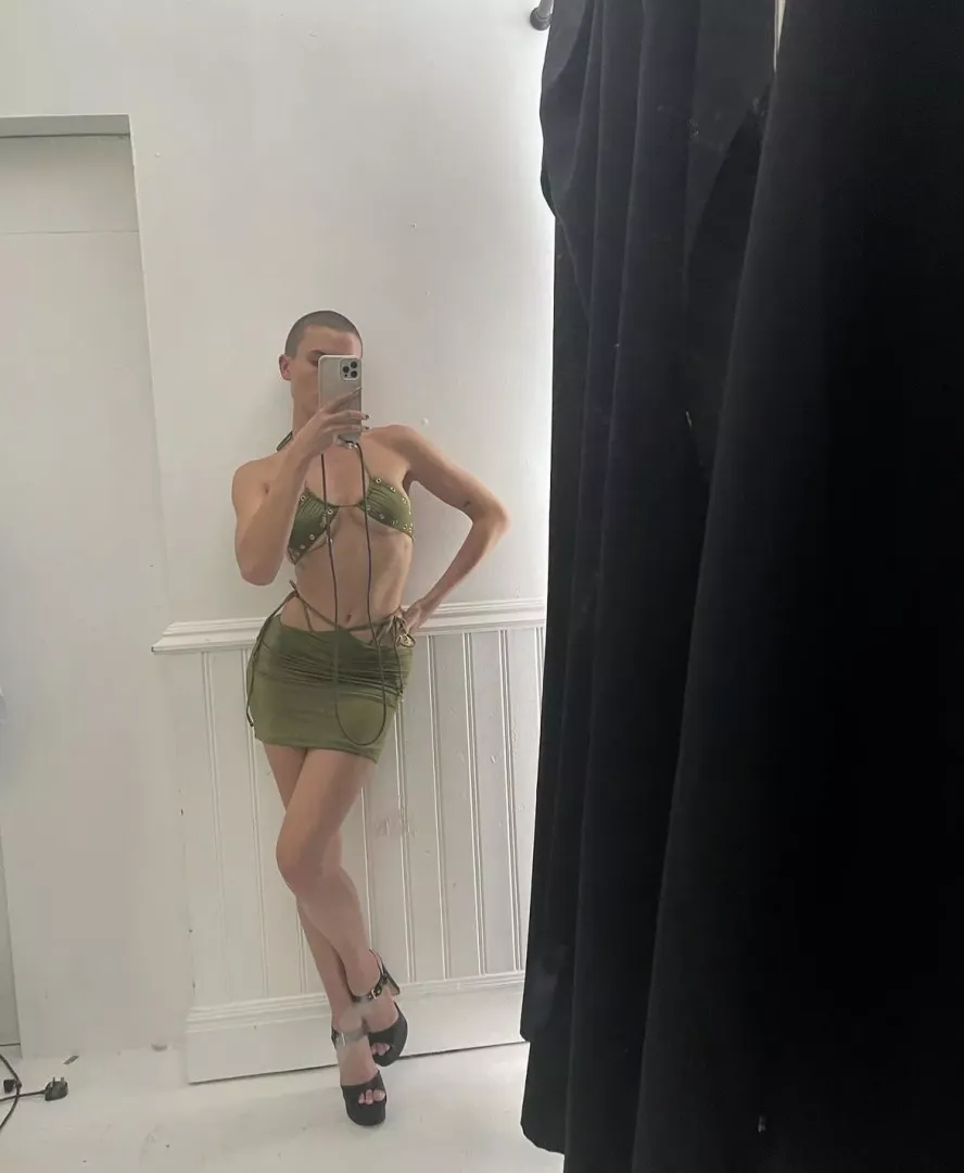 Rex looking hot in a skimpy top and tight and short skirt