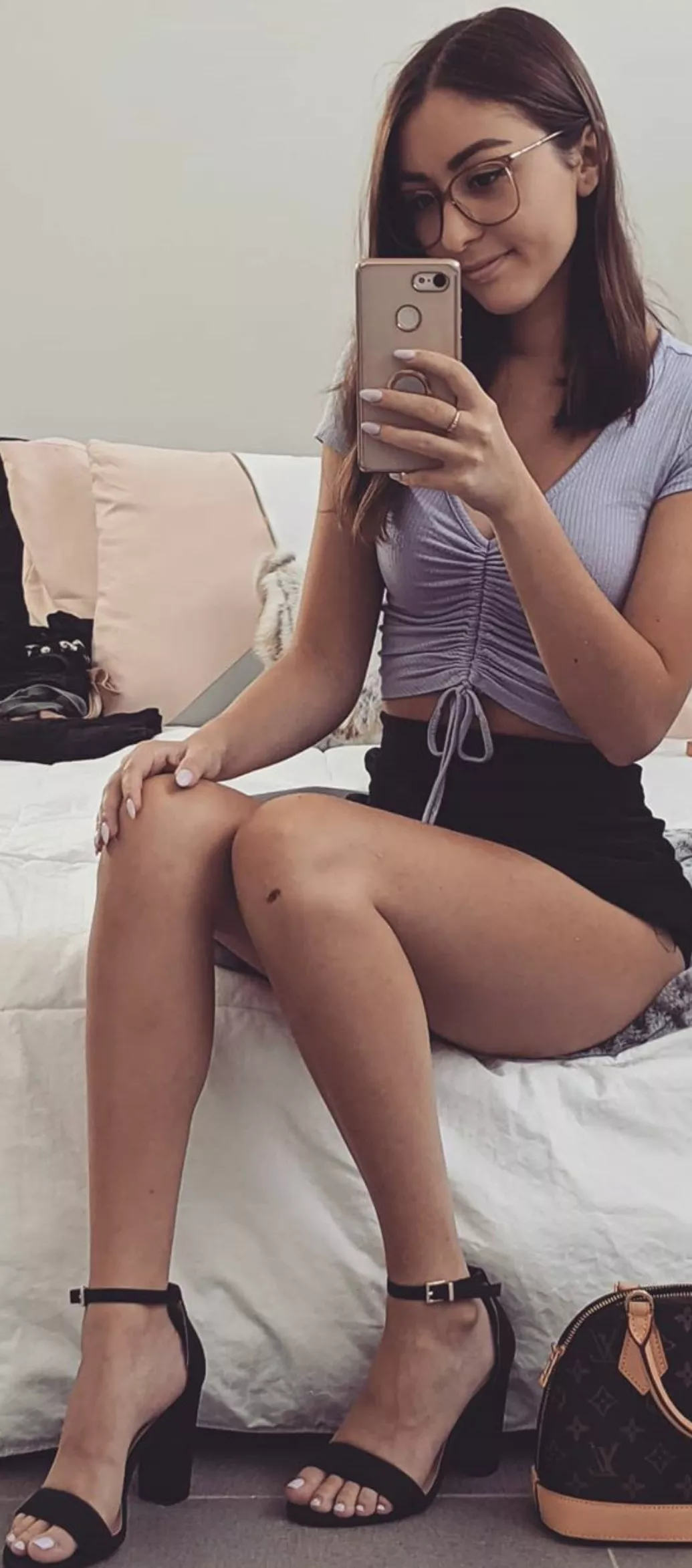 Showing off her legs in heels