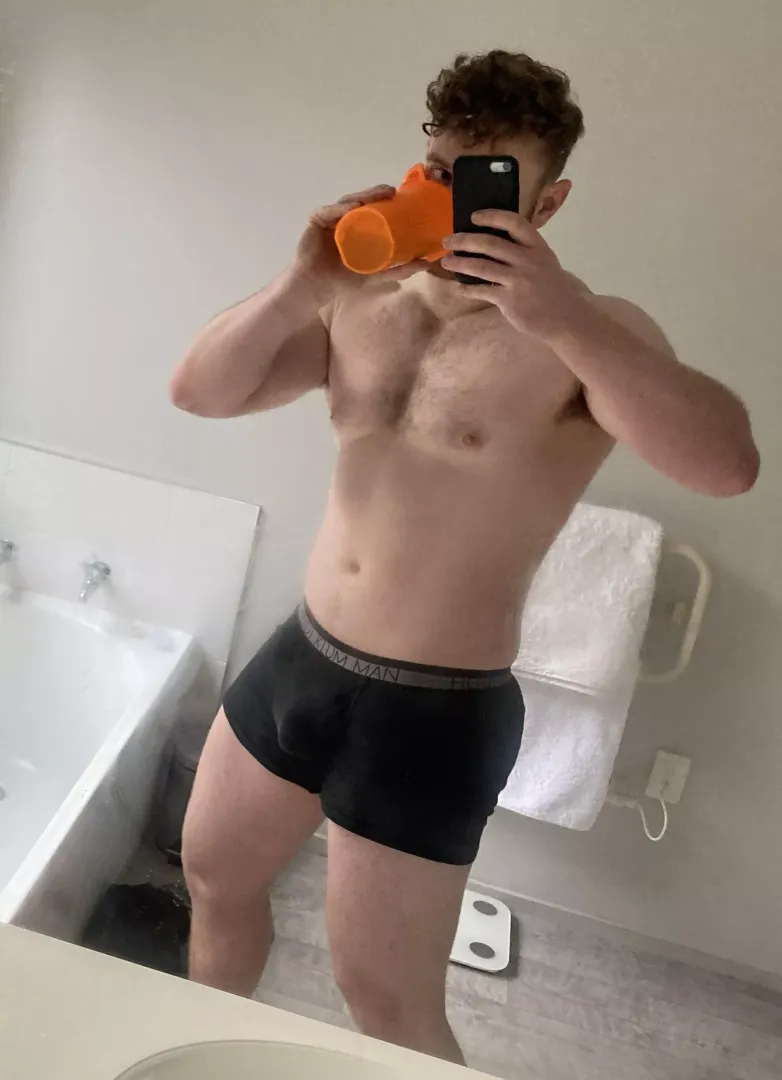 Slurping on a shake in my black jocks after the gym 😋
