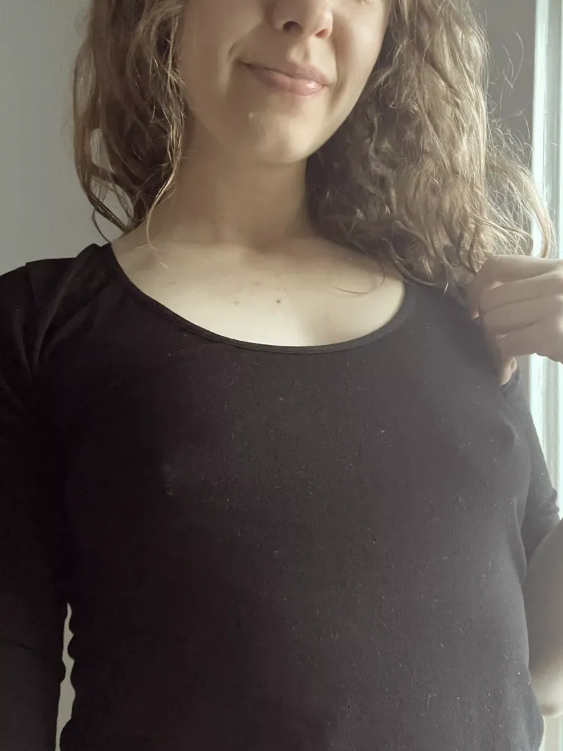 Smiling because no bra!