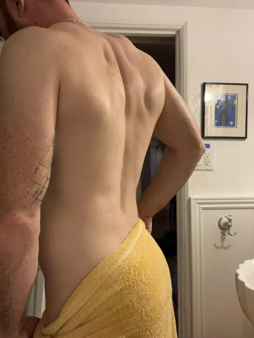 Start at my back, and put your hands on my towel. Kiss my neck, and slowly take it off…