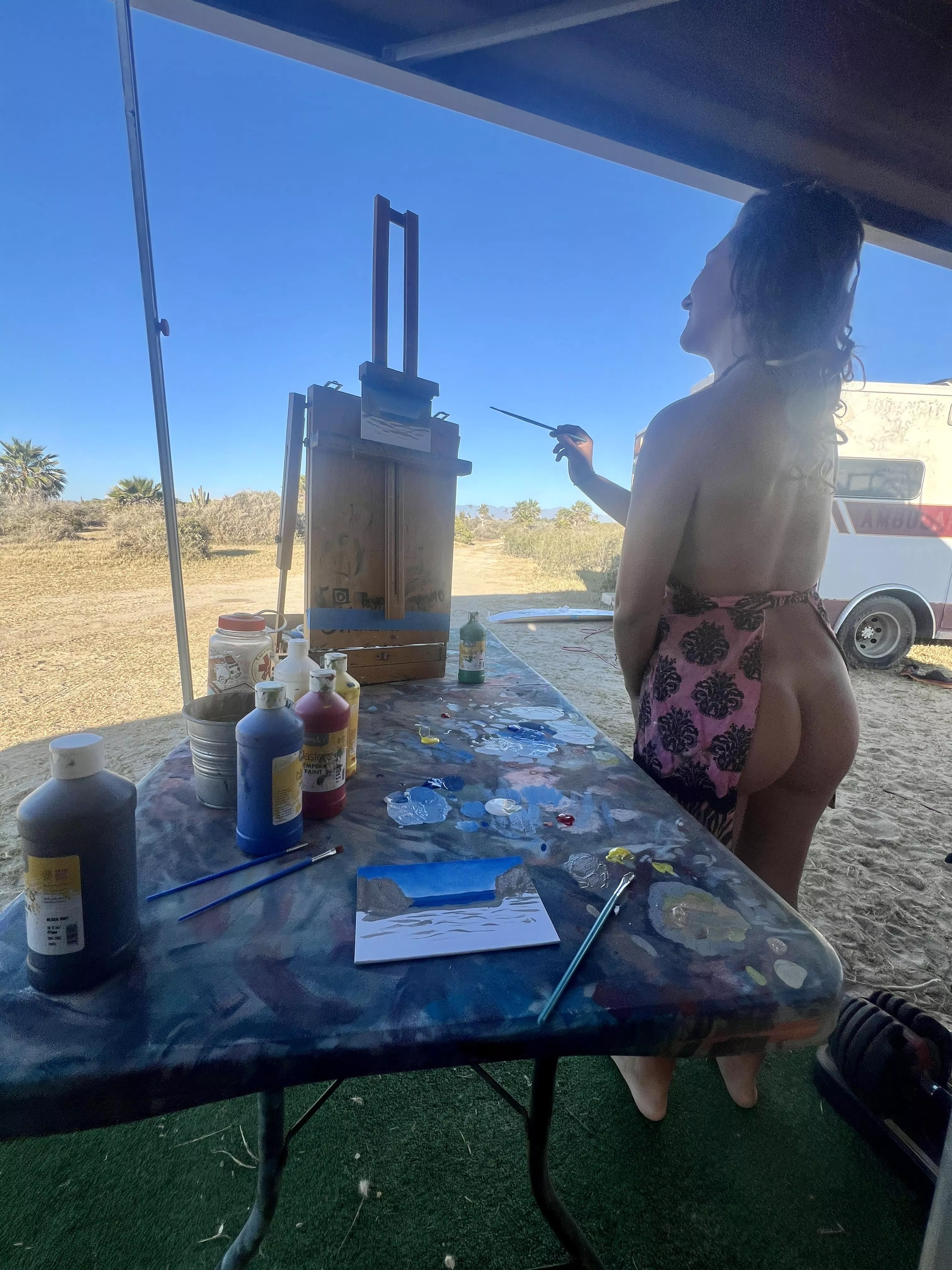 The apron is just for safety reasons. Oil paint can be toxic!