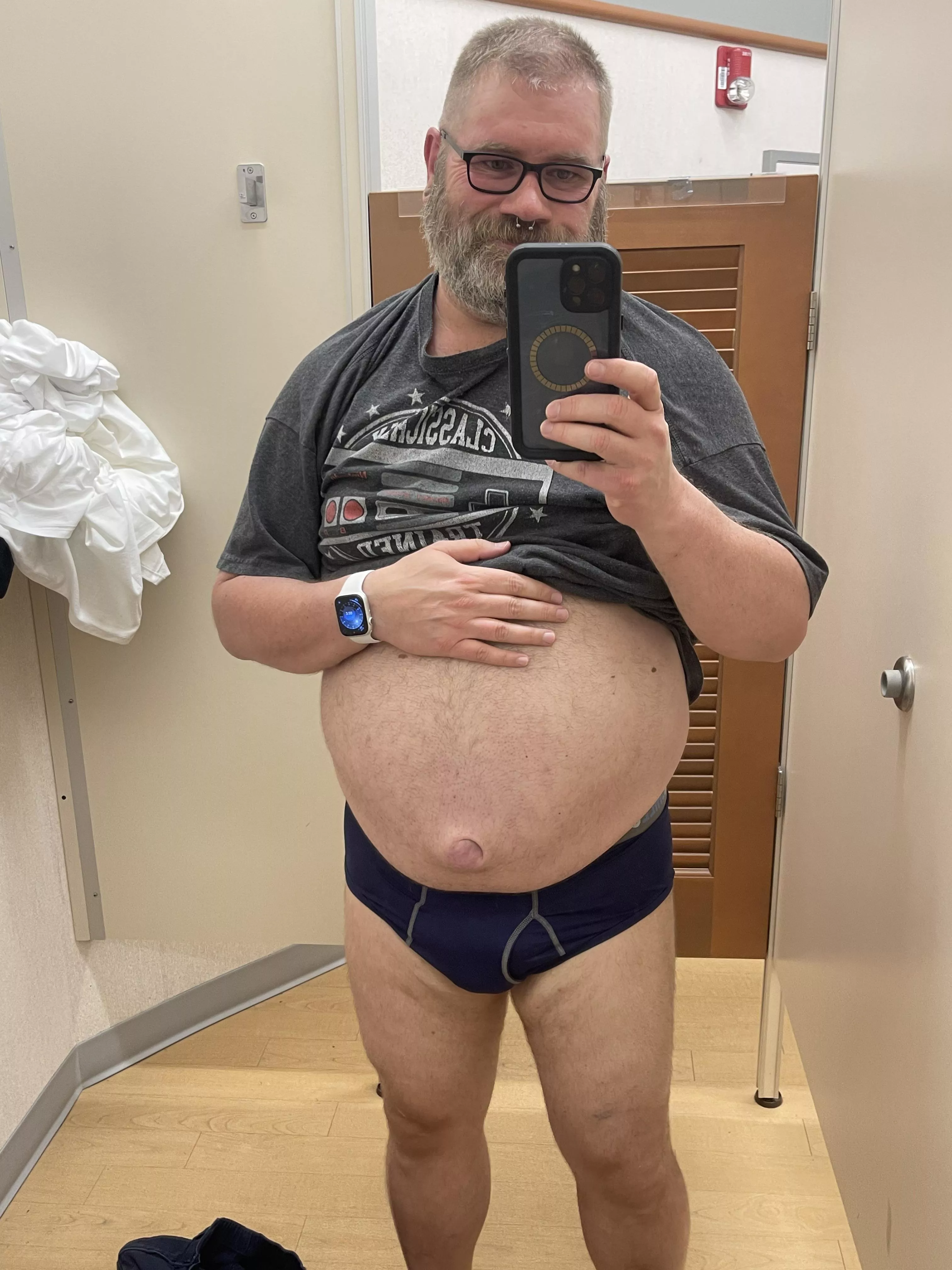 Trying on some clothes. 