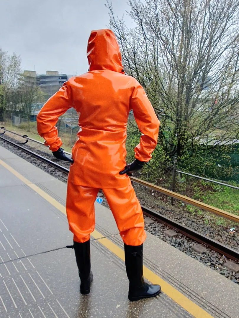 Wearing my thick latex rainwear on the subway! 