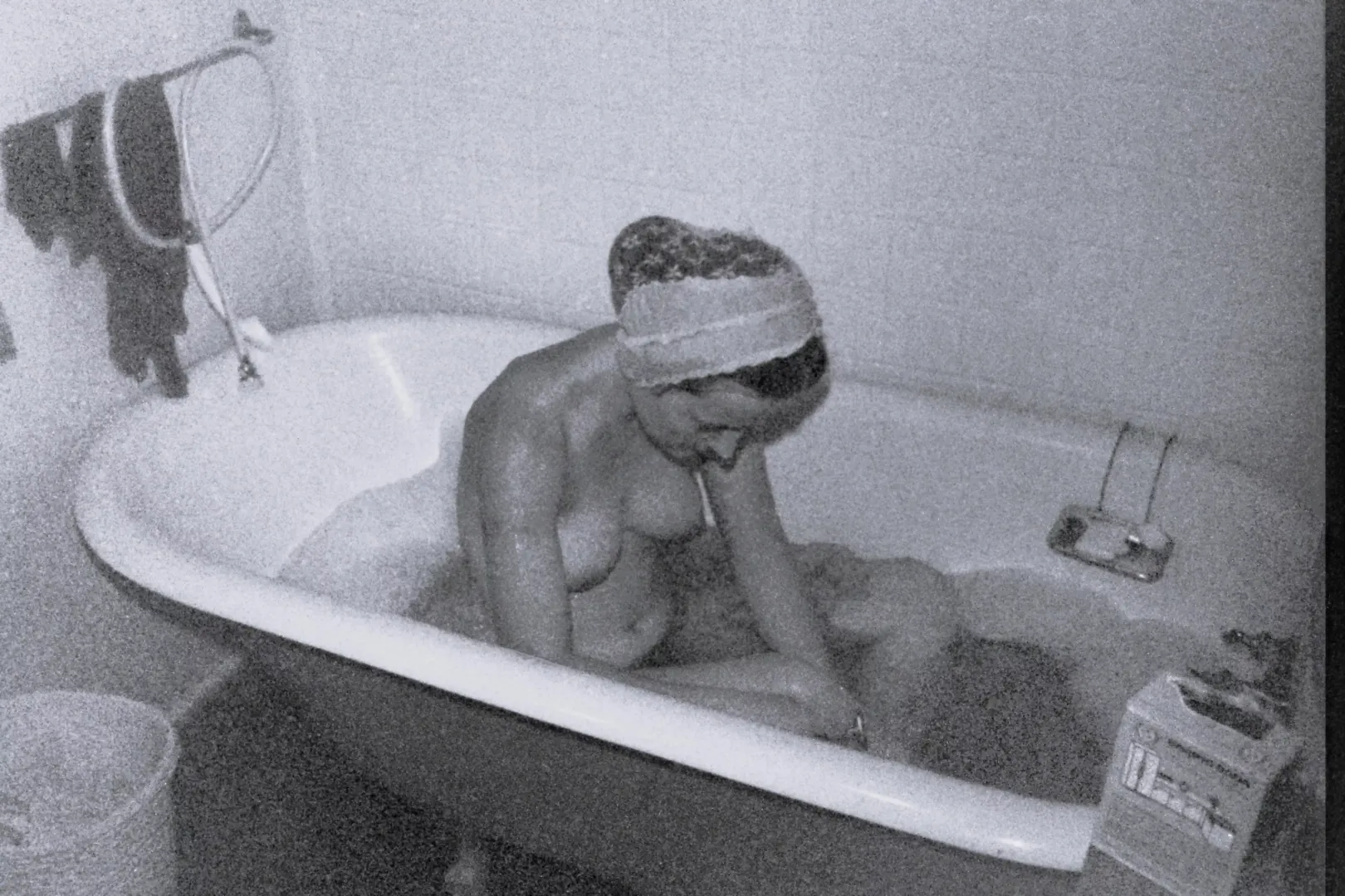 Yes, my turn for a bath! During cold weather, Saturday night was warm bath night on our hippie commune - this old tub kept the water warm. Early 1970s.